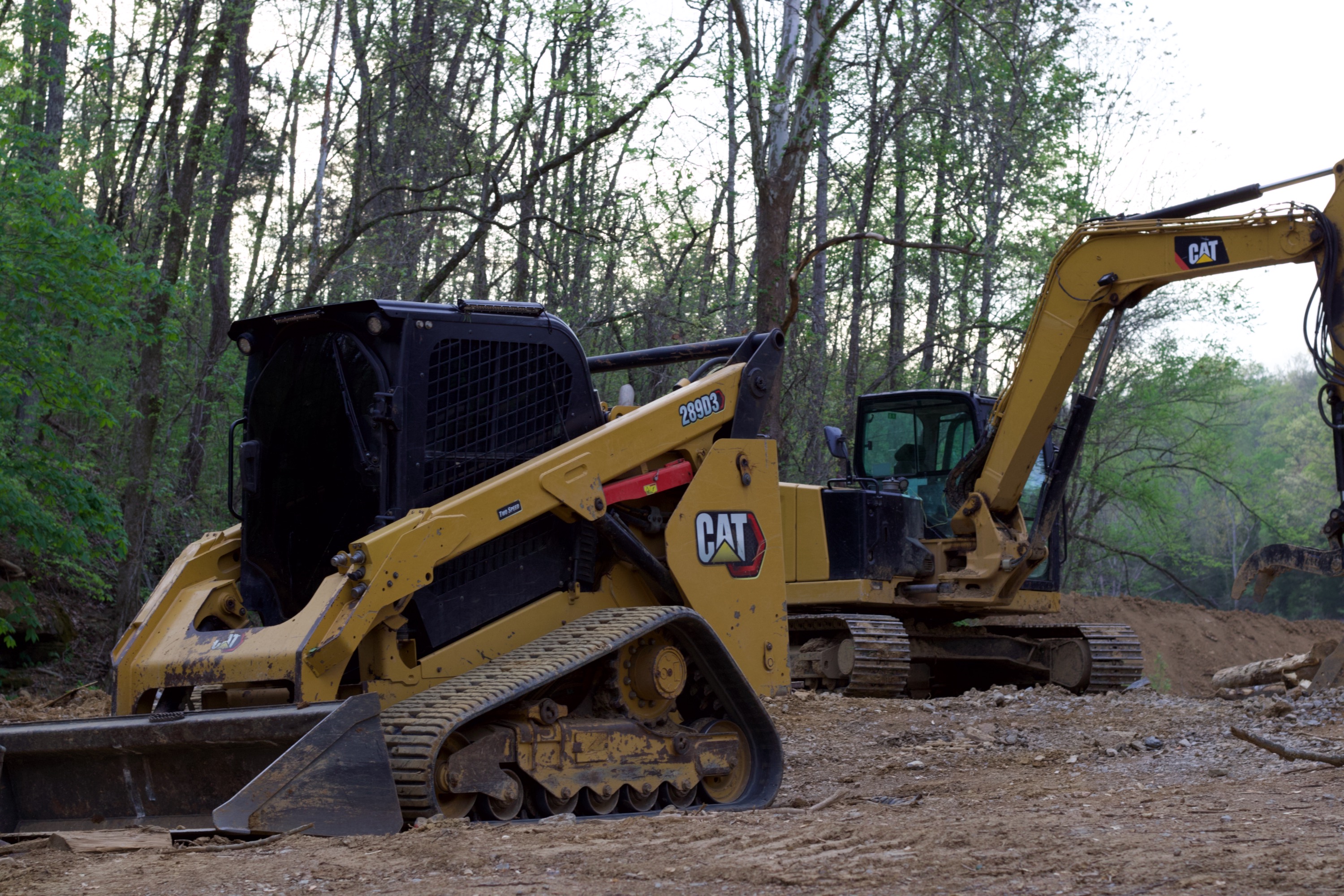 CAT skid steer and excavator staged on job site in Nashville TN